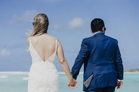 Married couple walking on the beach Stock Photos