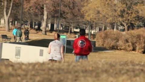 Married couple walking in the park Stock Footage
