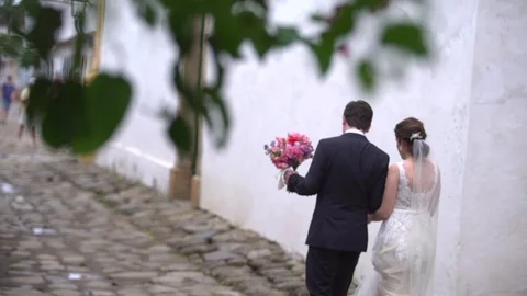 Married Couple walking in streets Stock Footage 73279506