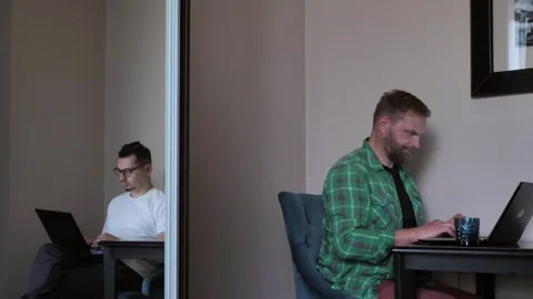Married couple working remotely. Young partners busy using laptops at home Stock Footage 254796838