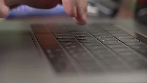 Married man types on a laptop keyboard close up Stockbeeldmateriaal 135826657