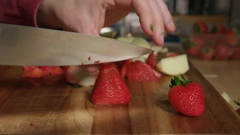Married Man with Wedding Ring Cutting Strawberries in Slow Motion Stock Footage 125313502