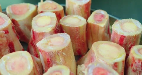 Marrow bones for pilaf in metal tray, close-up Stock Footage 346802668