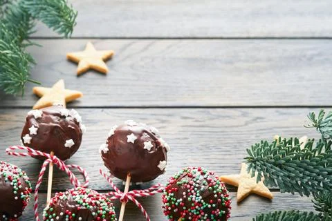 Marry Christmas sweet cake pops. Christmas dessert round brownie cake pops wi Stock Photos