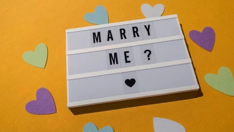 "Marry me?" sign displayed on a lightbox Stock Footage 85908810
