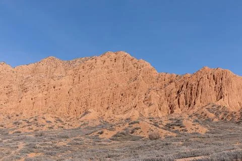 Mars Canyon red sandstone cliffs and desert landscape under clear blue sky Stock Photos