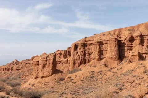 Mars Canyon red sandstone cliffs and desert landscape near Bokonbayevo Stock Photos