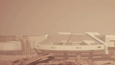 Mars habitat during a dust storm with rocky terrain and structures Stock Footage 343555454