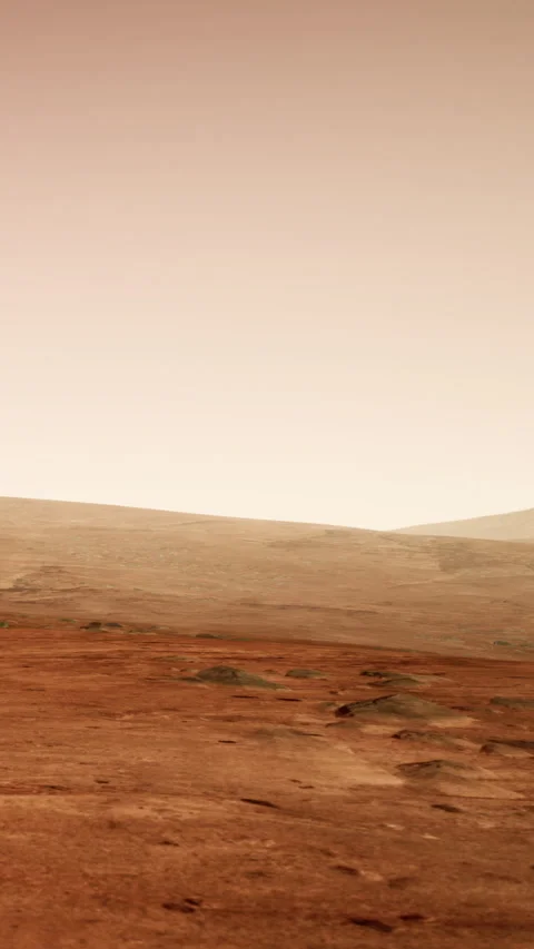 Mars landscape shows rocks and dusty ground under a hazy sky during sunset Stock Footage 339044445
