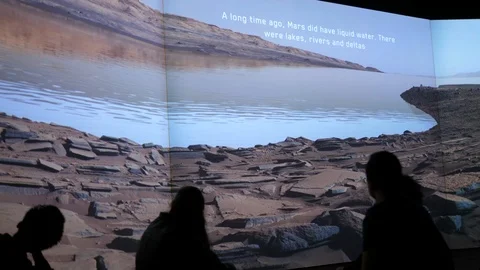 Mars liquid water on surface of Red planet. Rivers, Lakes, Deltas. People watch. Stock Footage 124426269
