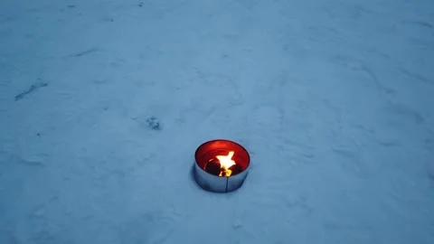 Marschall candle burning on ground in winter Stock Footage 149169352