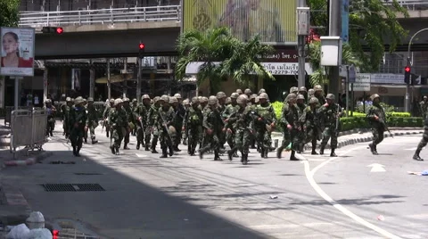 Marshal Law War TROOPS SOLDIERS AVANCE FORWARD Move Confront Protesters Rioters Stock Footage
