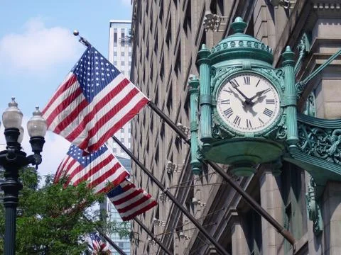 Marshall field's clock and american flags Stock Photos