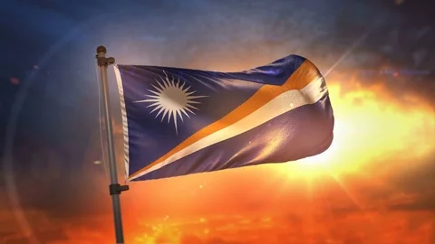Marshall Islands Flag Backlit At Beautiful Sunrise Loop Slow Motion 4K Stock Footage 76587483