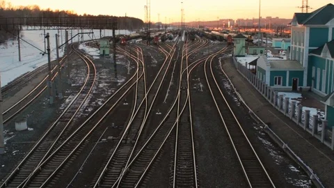 Marshalling railway yard with many lines cargo trains at sunset Russian Railways Stock Footage 75363787