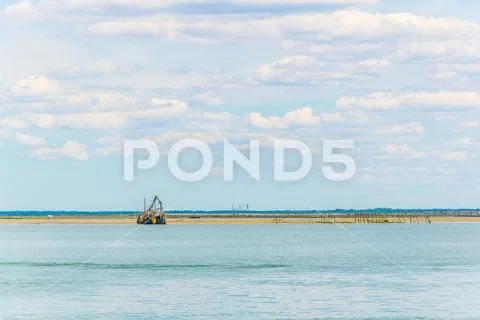 Marshes and oyster farms on the Ile aux Oiseaux near Arcachon, France. Stock Photos