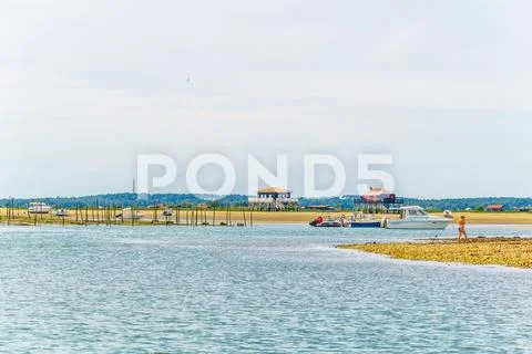 Marshes and oyster farms on the Ile aux Oiseaux near Arcachon, France. Stock Photos