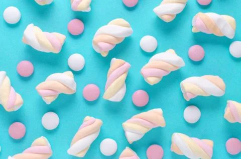 Marshmallow and candy, abstract pattern on blue background Stock Photos