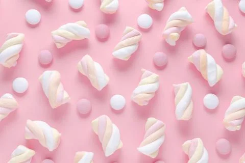 Marshmallow and candy, abstract pattern on pastel pink background Stock Photos