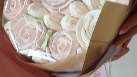 Marshmallow bouquets in craft packaging. Consist of zephyr roses and tulips.  Stock Footage 159348870