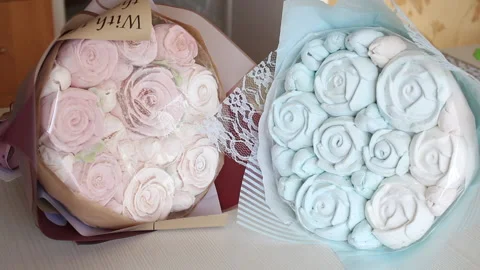 Marshmallow bouquets in craft packaging. Consist of zephyr roses and tulips.  Stock Footage 159348966