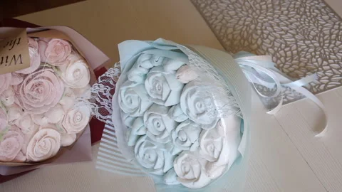 Marshmallow bouquets in craft packaging. Consist of marshmallow roses and tul Stock Footage 159348992