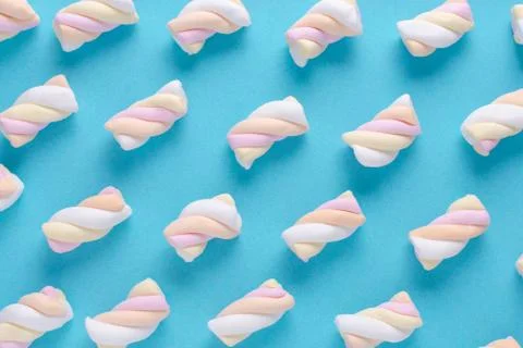 Marshmallow pattern on blue background, pastel colors Stock Photos