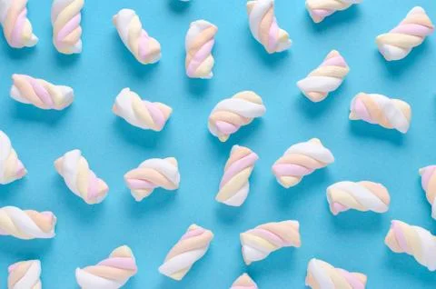 Marshmallow pattern on blue background, pastel colors Stock Photos