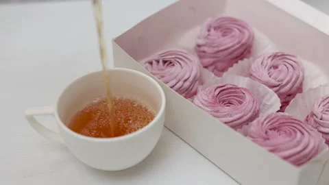Marshmallows with blackberries taste in box or kitchen tiles 스톡 동영상 242591694