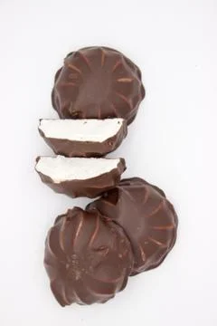 Marshmallows in chocolate. The isolated image on the white background. Stock Photos