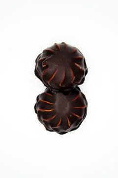 Marshmallows in chocolate on white background Stock Photos