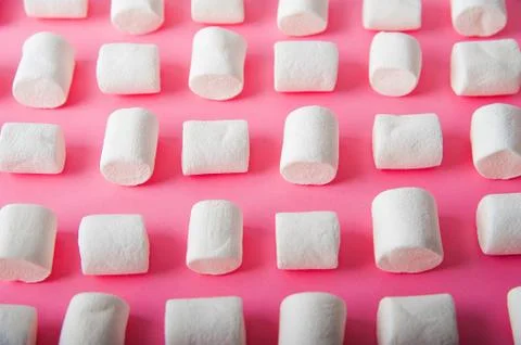  Marshmallows close-up and copy space on a pink background.  Stock Photos