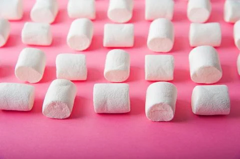  Marshmallows close-up and copy space on a pink background.  Stock Photos