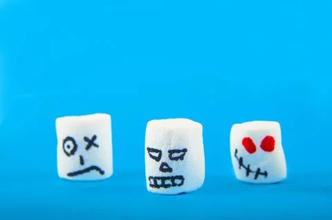 Marshmallows close-up and copy space on blue background. Marshmallows for Hallow Stock Photos