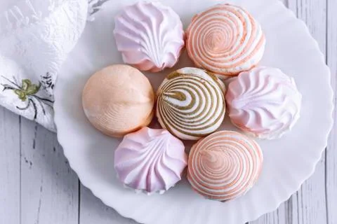 Marshmallows of different varieties on a plate. Stock Photos