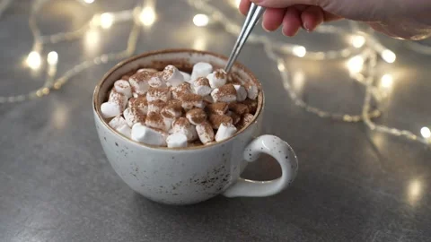 Marshmallows dropping cup with delicious hot chocolate cocoa drink. Slow motion. Stock Footage 231795034