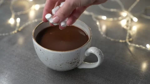 Marshmallows dropping cup with delicious hot chocolate cocoa drink. Stock Footage 231795036