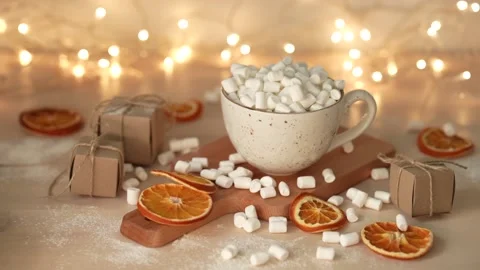 Marshmallows dropping cup with delicious hot chocolate cocoa drink. Slow motion. Stock Footage 231795162