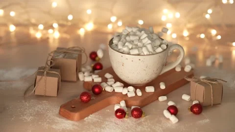 Marshmallows dropping cup with delicious hot chocolate cocoa drink. Slow motion. Stock Footage 231795169