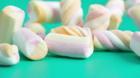 Marshmallows falling on a pastel background . Super slow motion 1000 fps Stock Footage 281561729