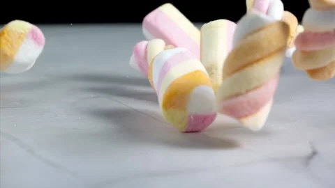 Marshmallows falling on a pastel background . Super slow motion 1000 fps Stock Footage 281562081