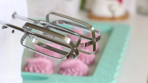 Marshmallows lies on a tray. It stabilizes after formation. Shot through the  Stock Footage 134450221