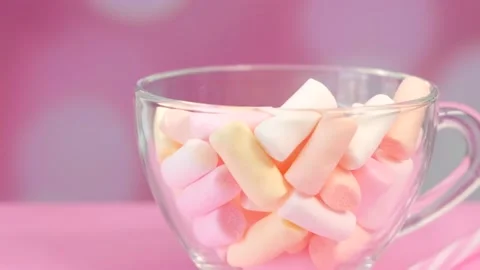 Marshmallows in a mug On a bright pink background Stock Footage 154297790