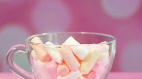 Marshmallows in a mug On a bright pink background Stock Footage 154631338