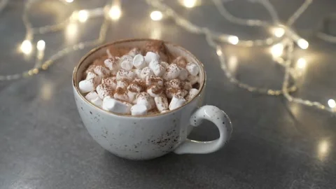 Marshmallows in a mug with a hot drink sprinkle chocolate chips. Stock Footage 231795006