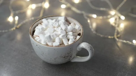 Marshmallows in a mug with a hot drink sprinkle chocolate chips. Stock Footage 231795007