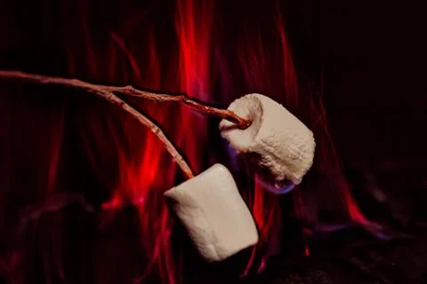 Marshmallows over a campfire close up Stock Photos
