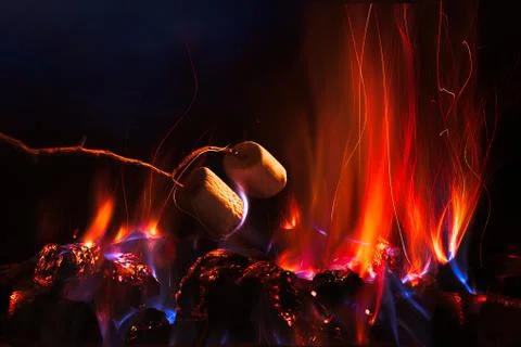 Marshmallows over a campfire close up Stock Photos