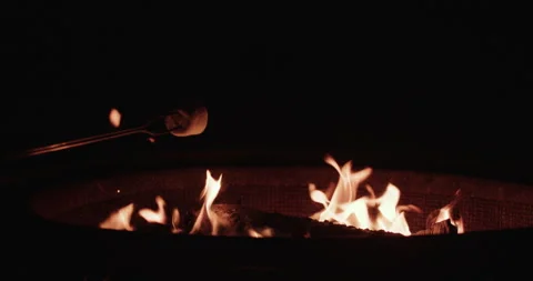 Marshmallows roasting by a fire 2 Stock Footage 252750938