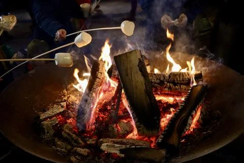 Marshmallows roasting over fire Stock Photos